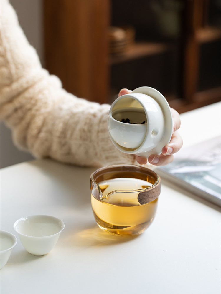 This is a glass teapot travel set