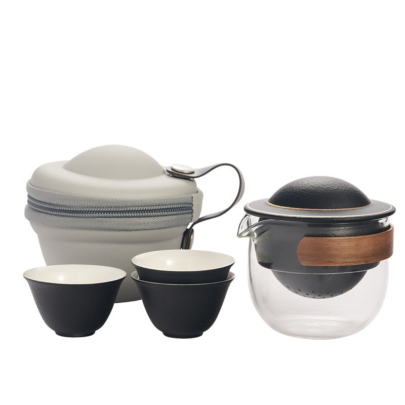 This is a glass teapot travel set
