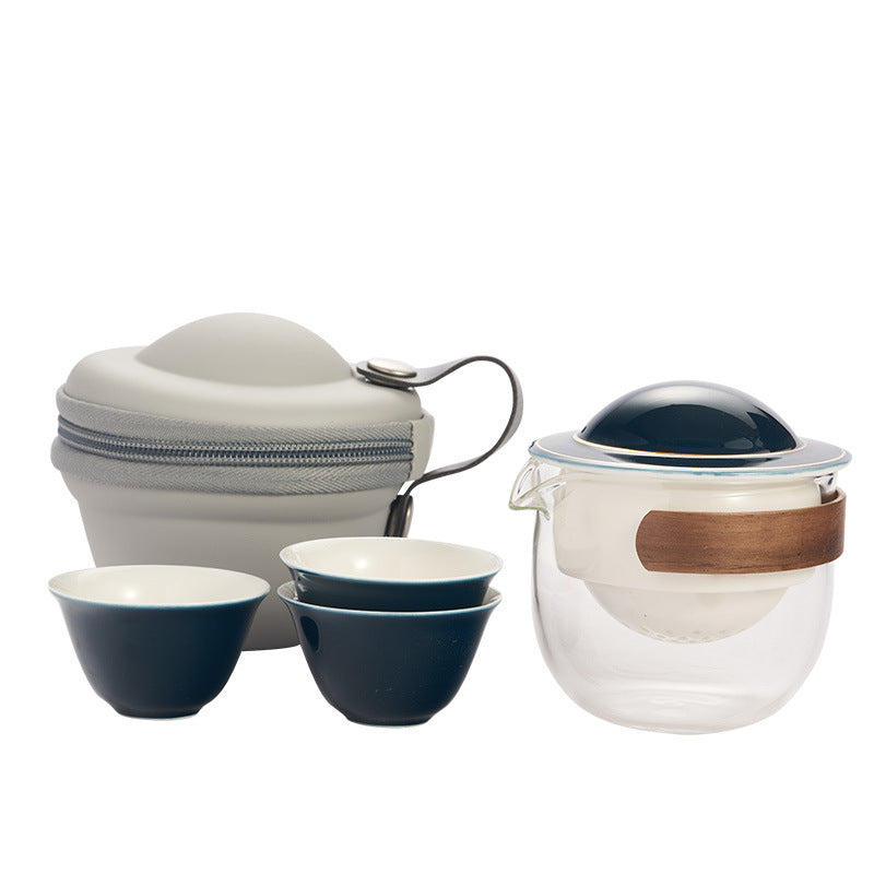 This is a glass teapot travel set