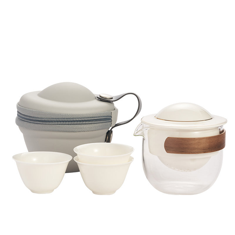 This is a glass teapot travel set
