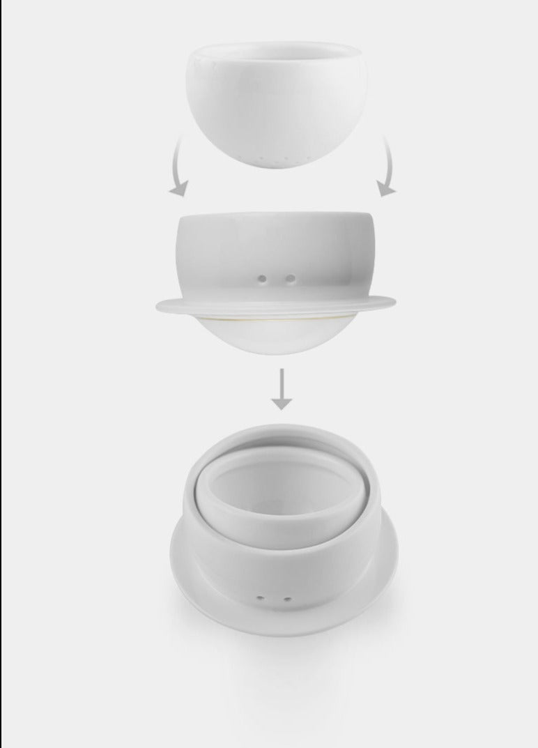 This is a glass teapot travel set