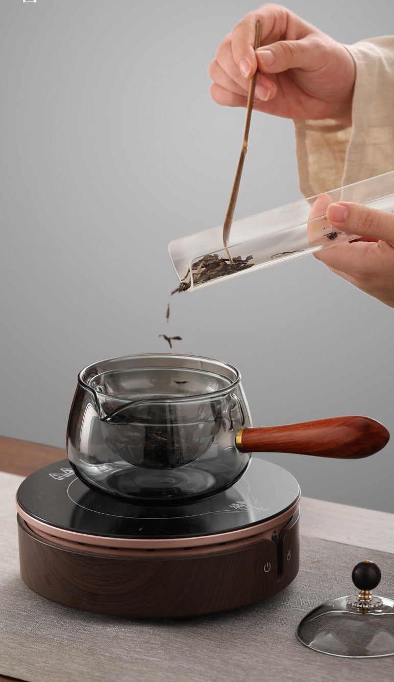 This is a side handle teapot set.this is a 360 rotating glass teapot