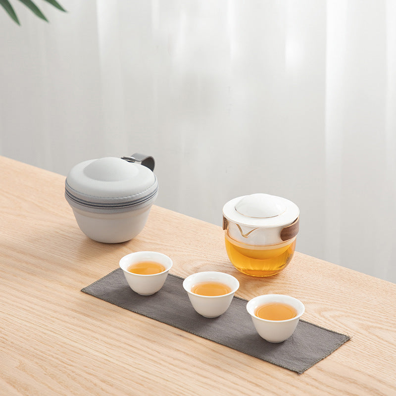 This is a glass teapot travel set