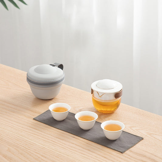 This is a glass teapot travel set