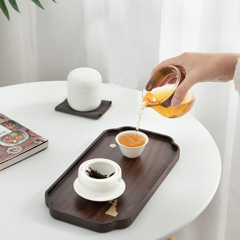 This is a glass teapot travel set