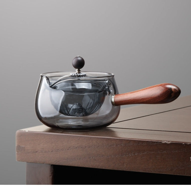 This is a side handle teapot set.this is a 360 rotating glass teapot