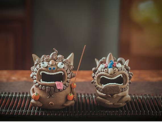 This is a pottery teapet incense holder