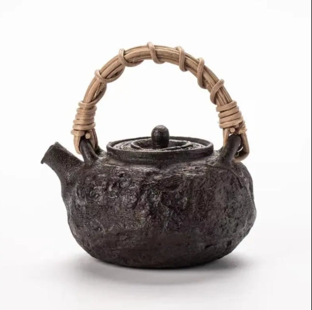 This is a pottery lifting handle kettle