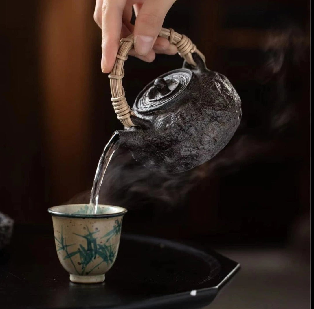 This is a pottery lifting handle kettle