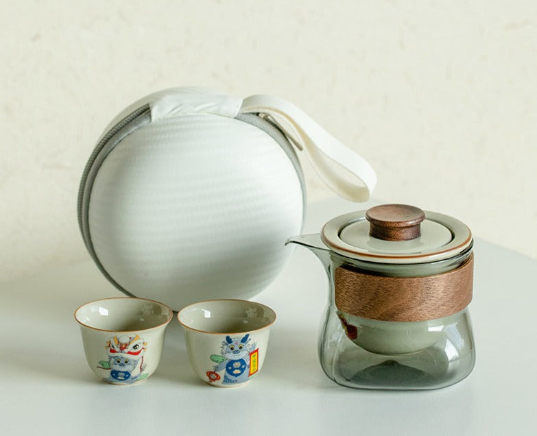 This is a ceramic teapot travel set