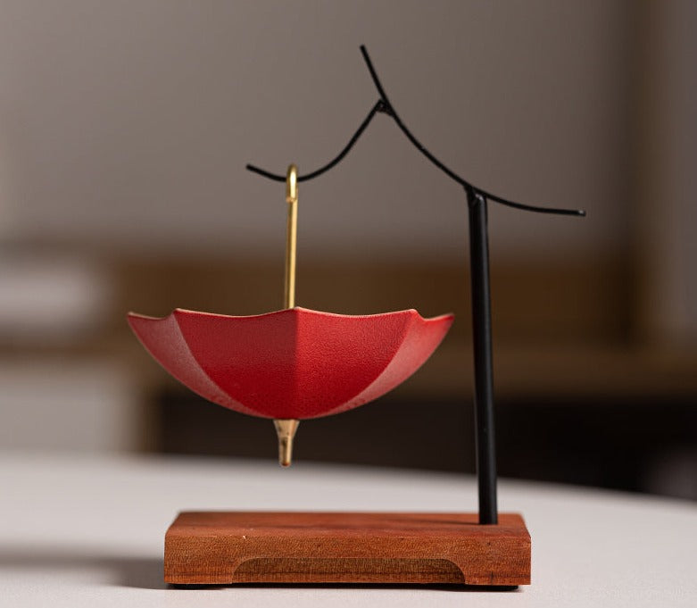 This is a ceramic umbrella shape tea filter tea strainer
