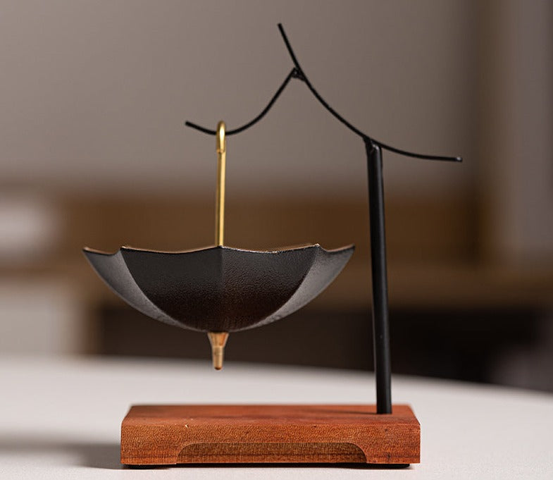 This is a ceramic umbrella shape tea filter tea strainer