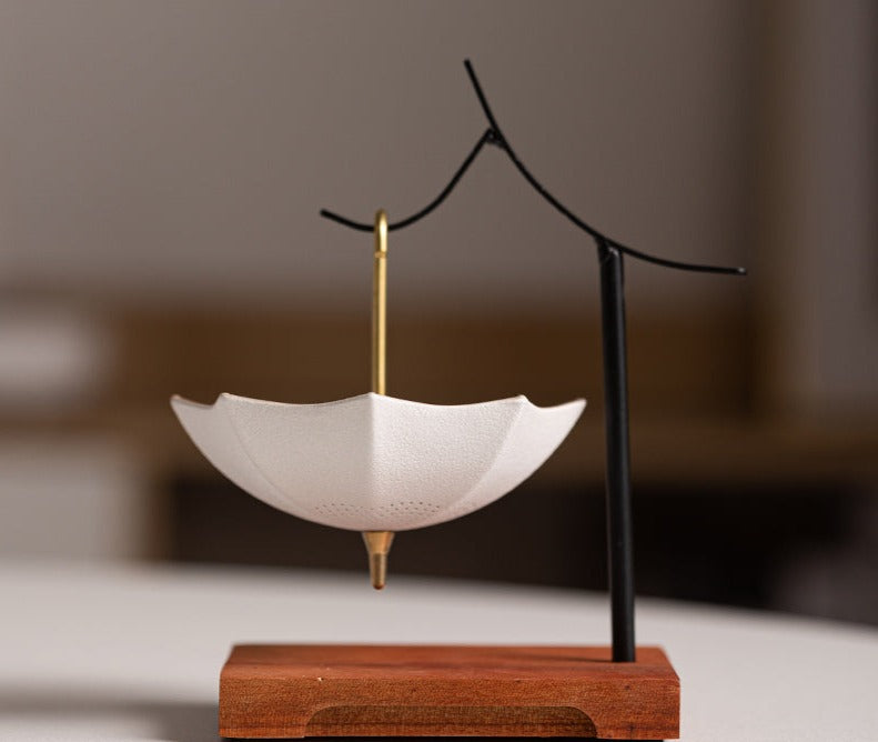This is a ceramic umbrella shape tea filter tea strainer