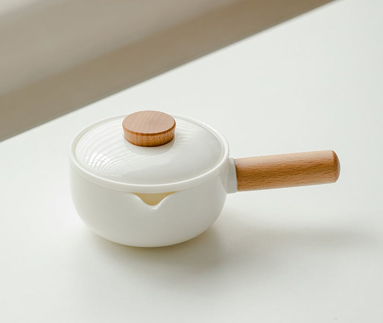 This is a ceramic teapot travel set