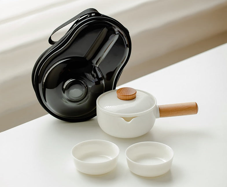 This is a ceramic teapot travel set