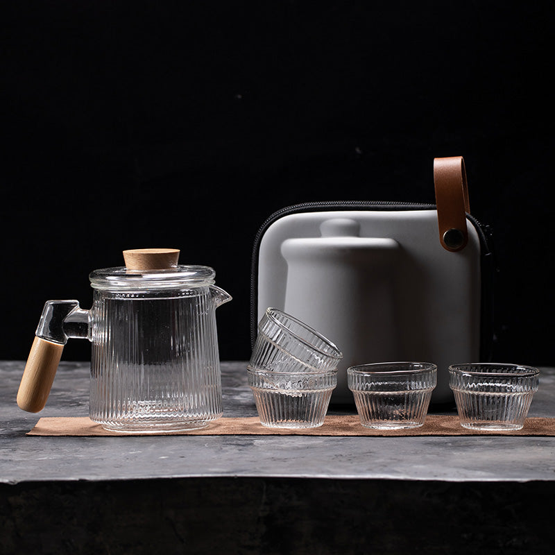 This is a glass teapot travel set
