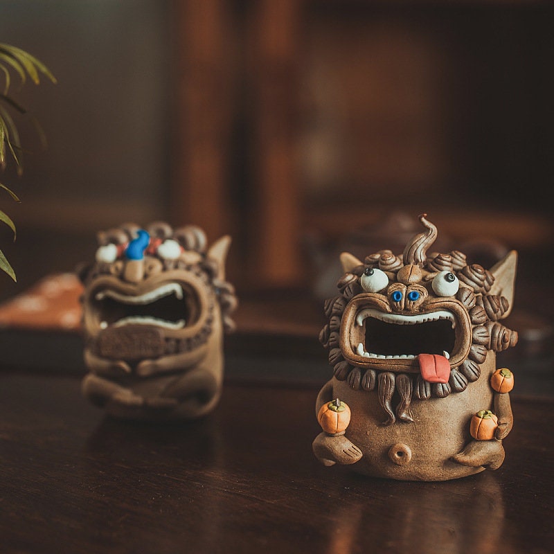 This is a pottery teapet incense holder