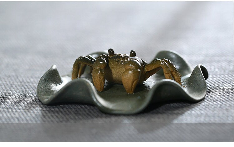 This is a Yixing clay color changing crab teapet