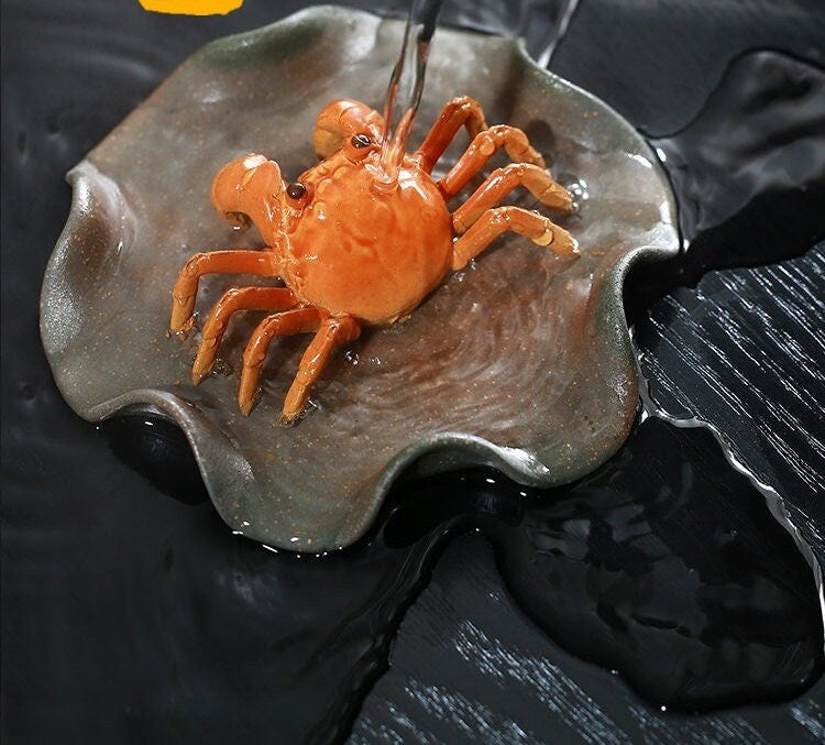 This is a Yixing clay color changing crab teapet