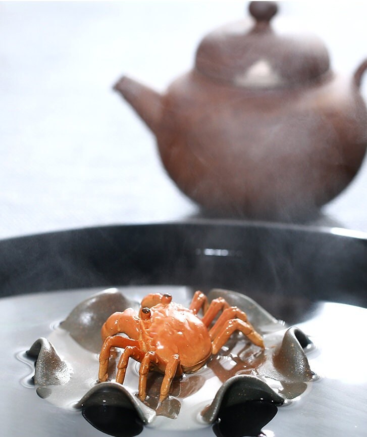 This is a Yixing clay color changing crab teapet