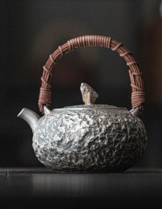 This is a gilted silver kettle