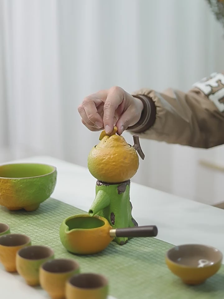 this is an automatic ceramic teapot.this is orange shape teapot