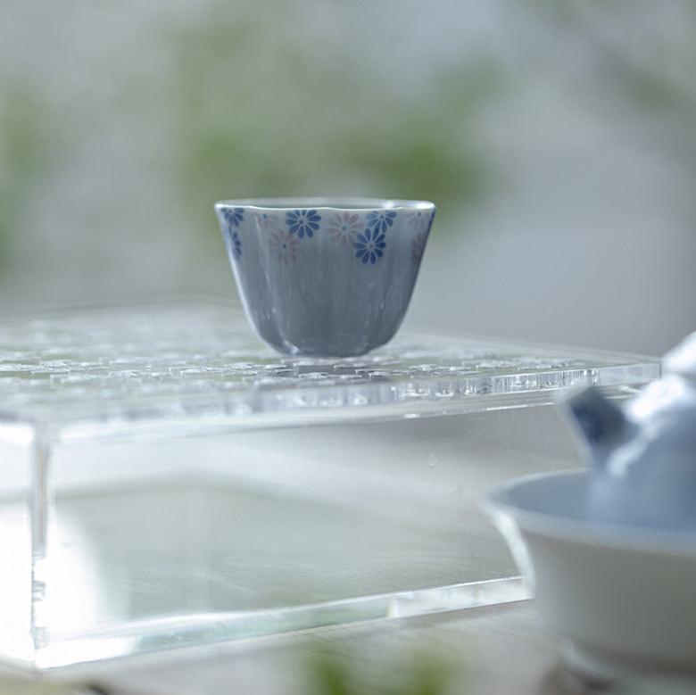 this is a ceramic teacup. this is a blue teacup