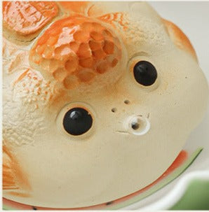 This is a Yixing purple clay bubble fish teapet