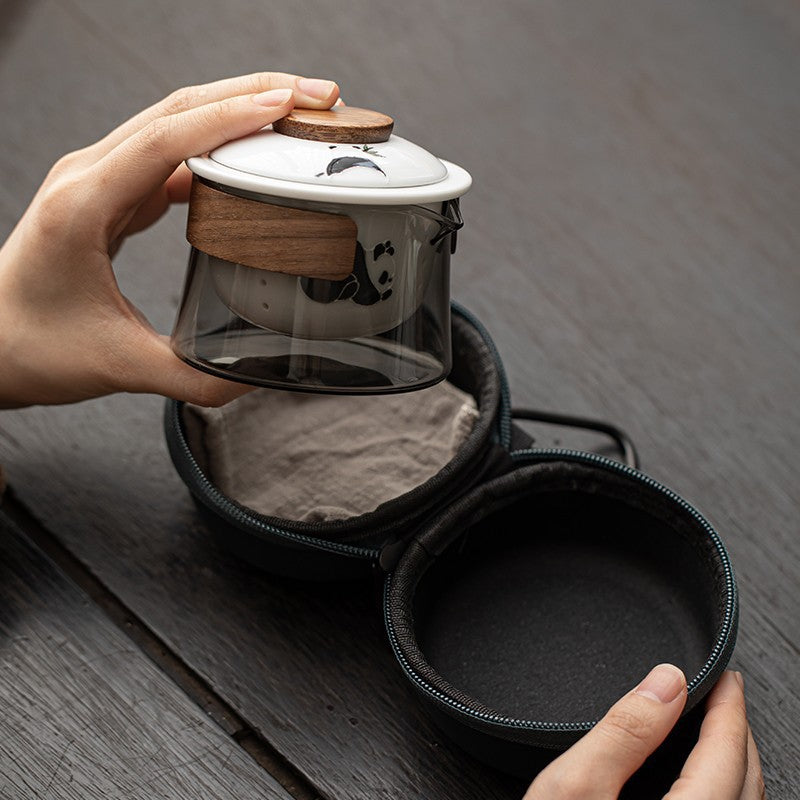 This is a ceramic teapot travel set