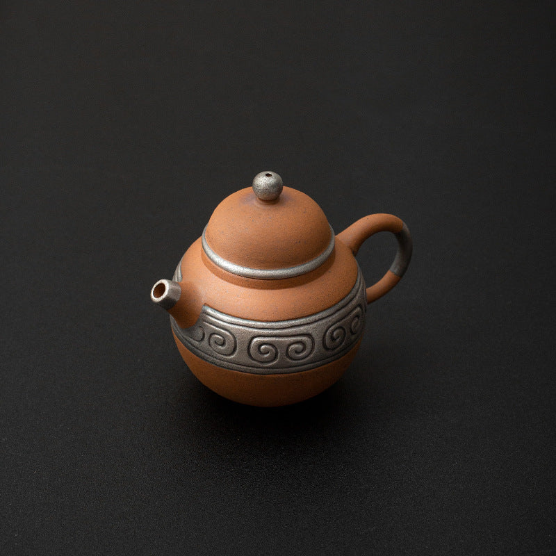 this is a pottery teapot. this is a pear teapot