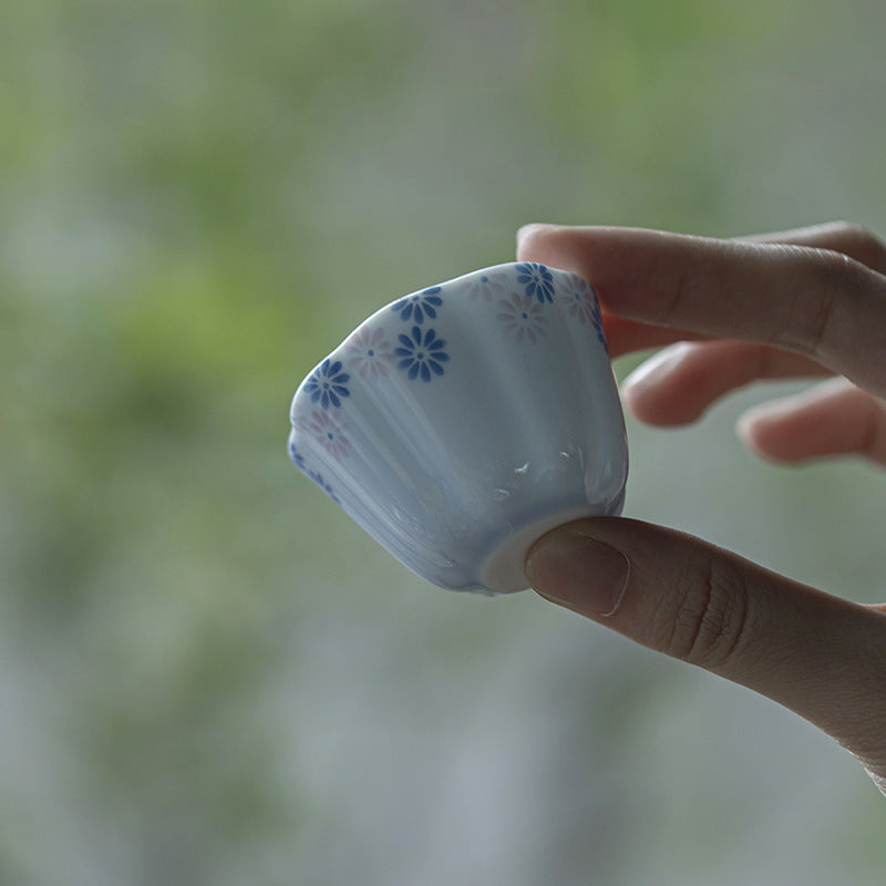 this is a ceramic teacup. this is a blue teacup