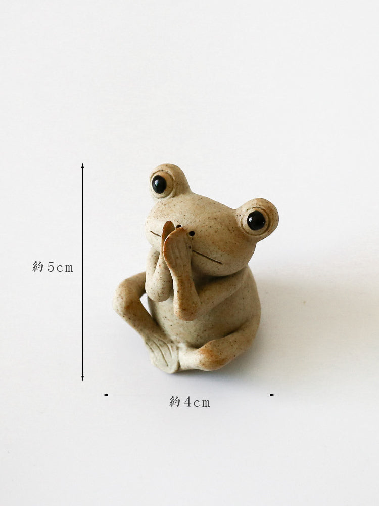 This is a pottery frog teapet