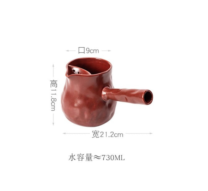 This is a pottery side handle kettle