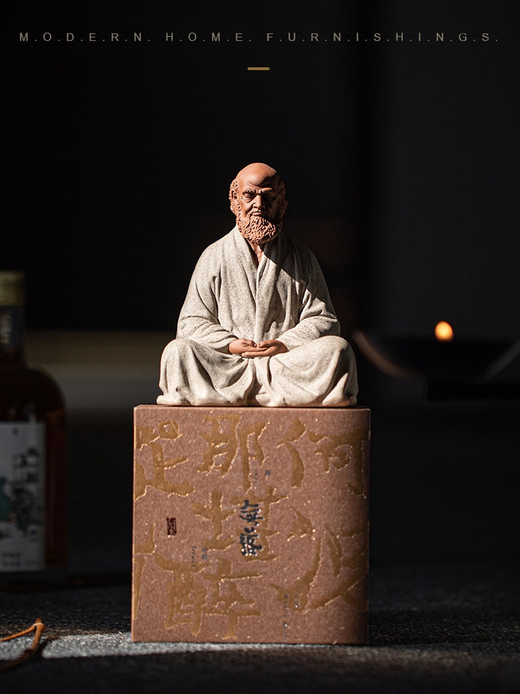 this is a pottery mini bodhidharma sculpture