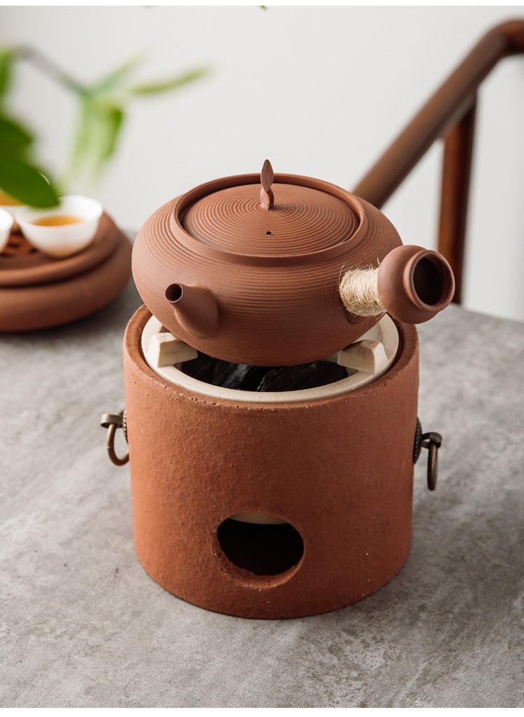 This is a pottery side handle kettle