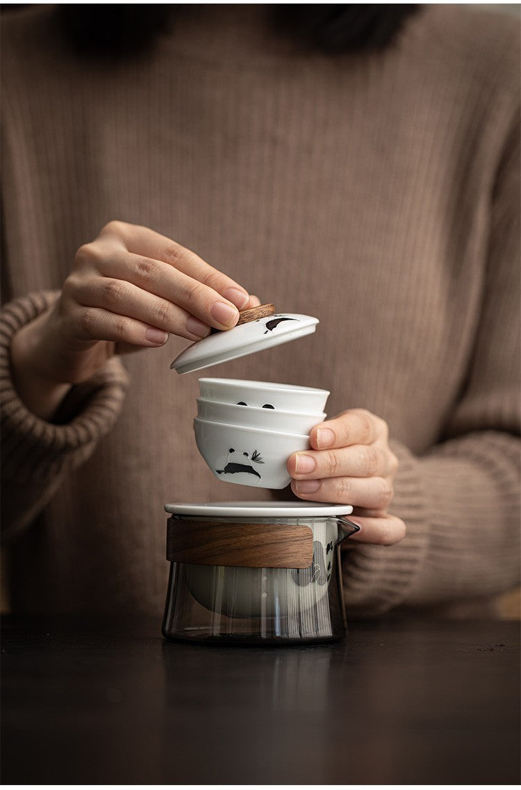 This is a ceramic teapot travel set