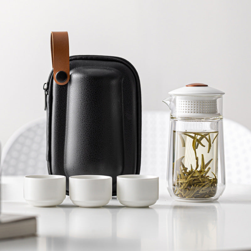 This is a glass teapot travel set