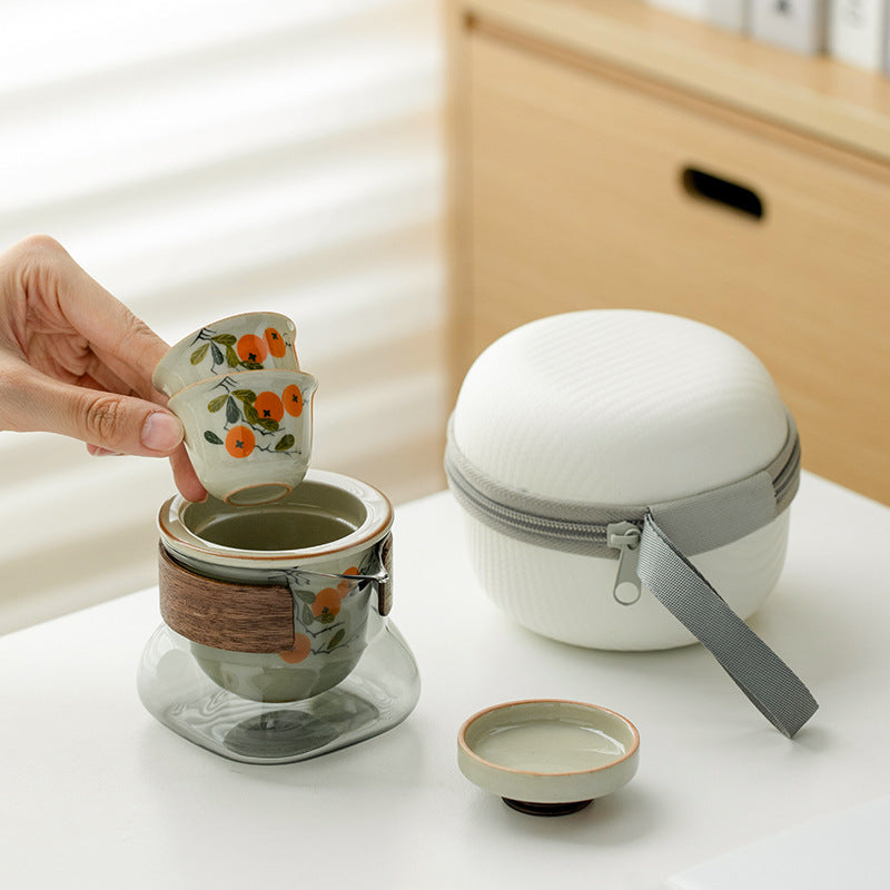 This is a ceramic teapot travel set