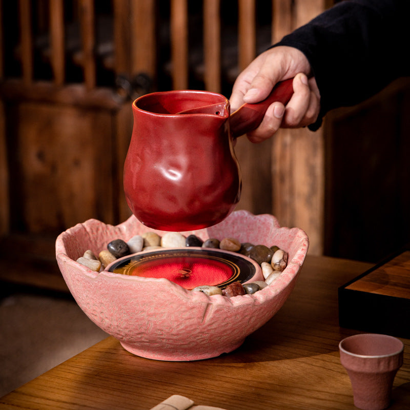 This is a pottery side handle kettle