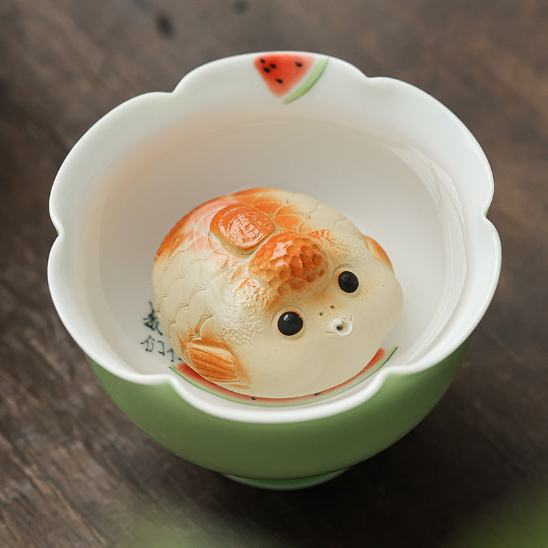 This is a Yixing purple clay bubble fish teapet