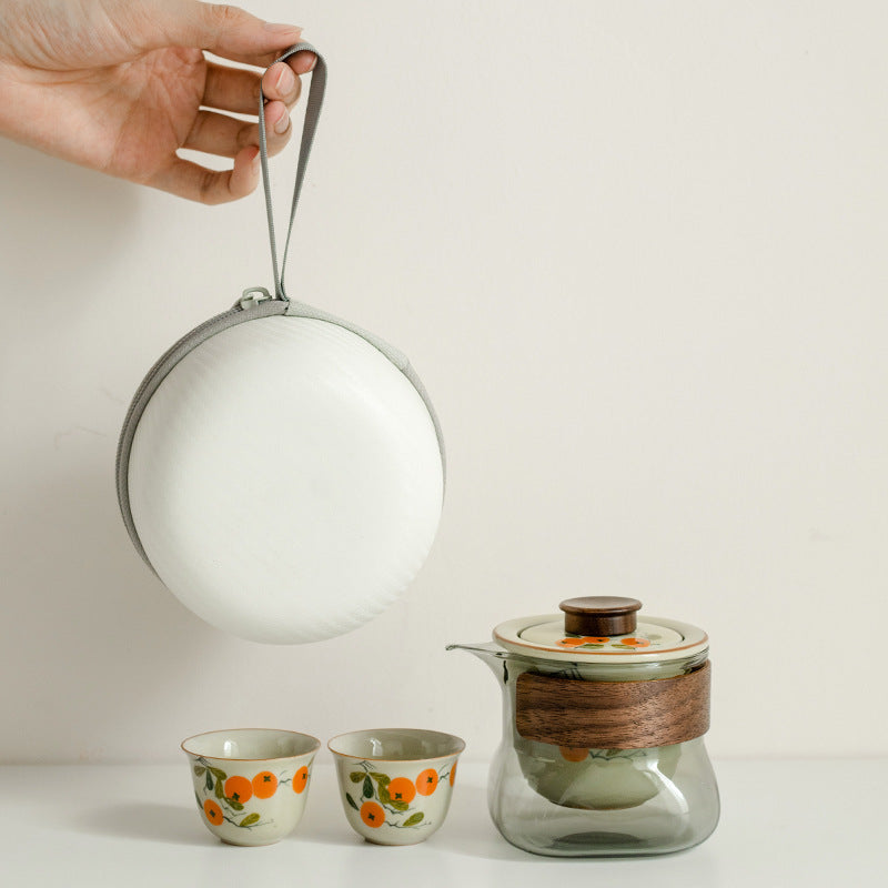 This is a ceramic teapot travel set