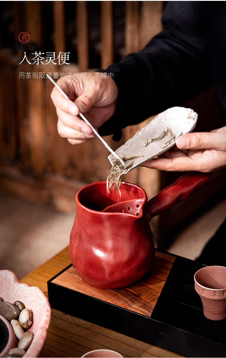 This is a pottery side handle kettle