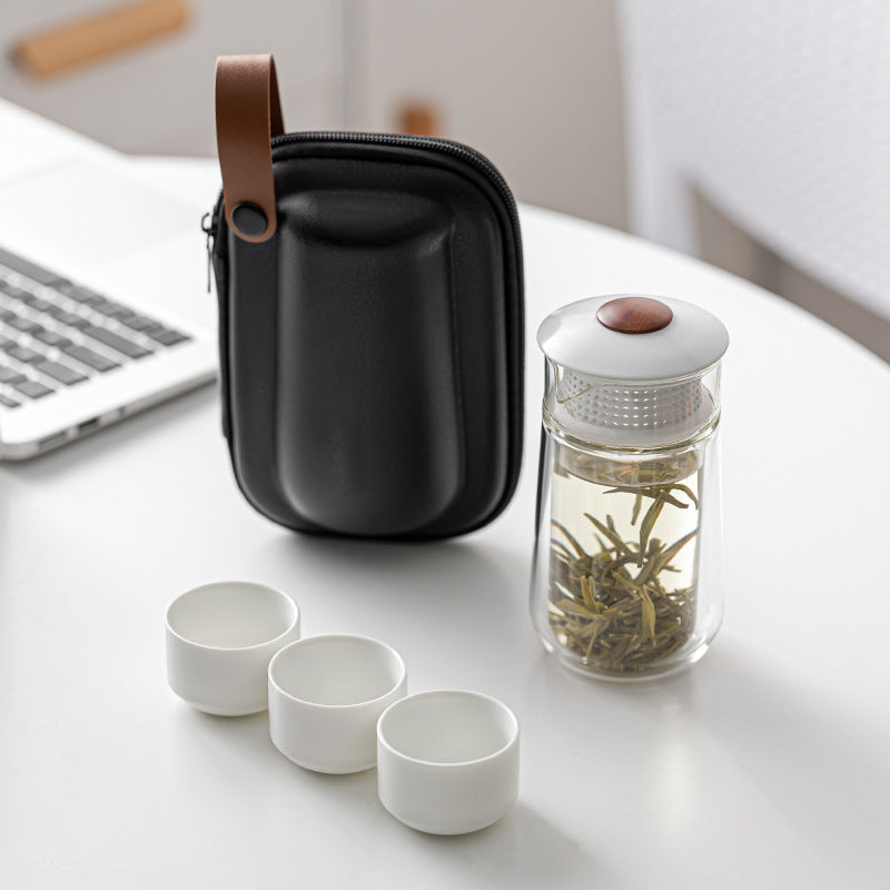 This is a glass teapot travel set