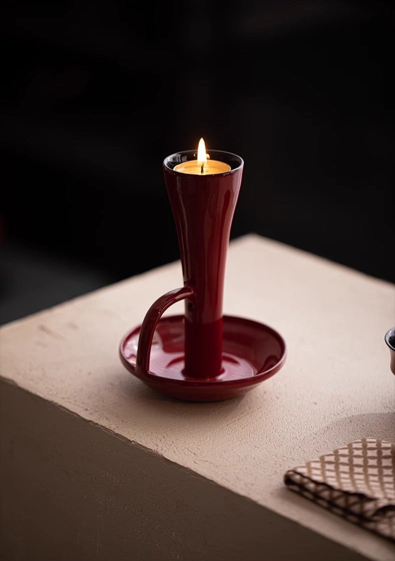 This is a ceramic candlestick candle holder