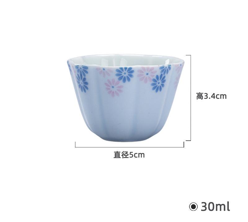 this is a ceramic teacup. this is a blue teacup