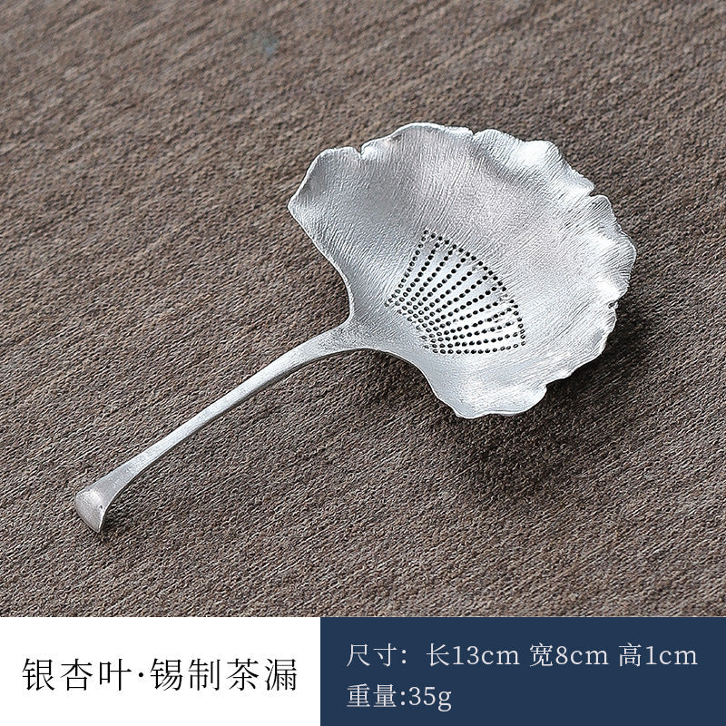 This is a tin tea scoop tea filter