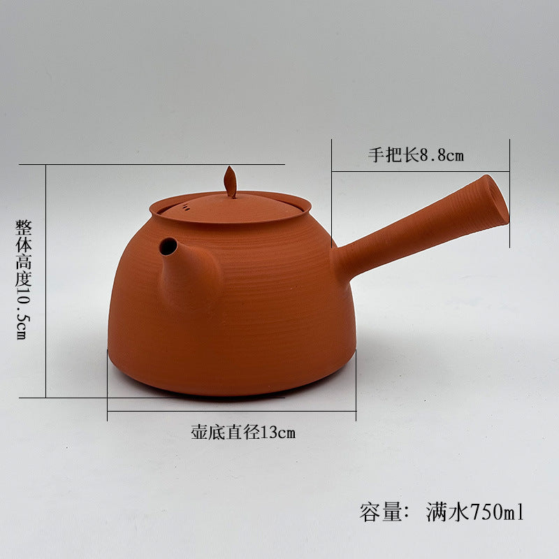 This is a pottery side handle kettle