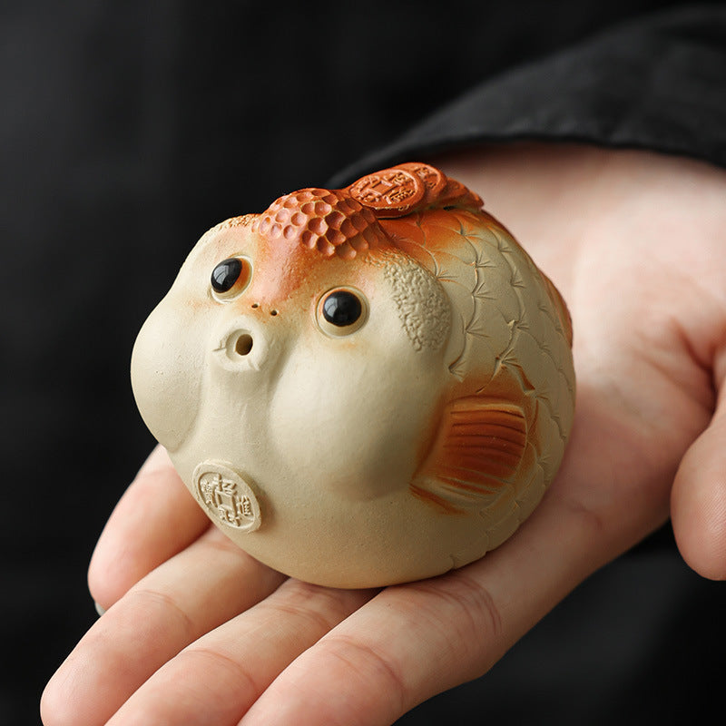 This is a Yixing purple clay bubble fish teapet