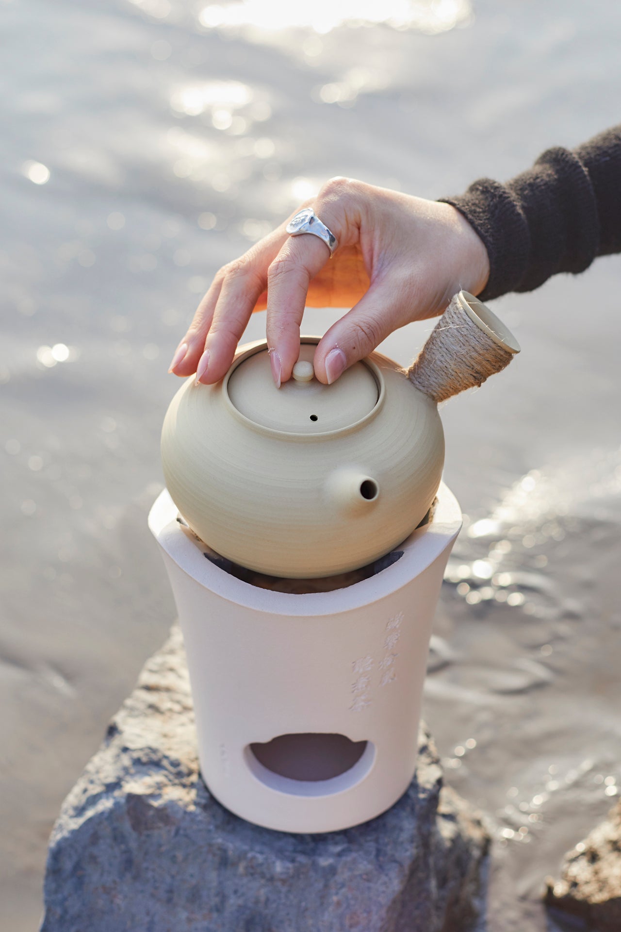 This is a pottery side handle kettle