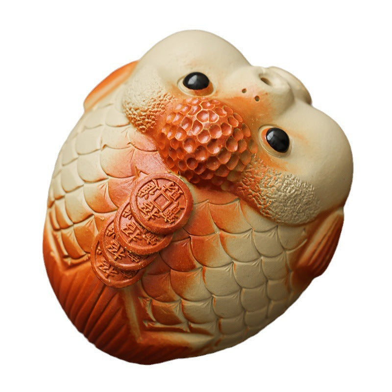 This is a Yixing purple clay bubble fish teapet